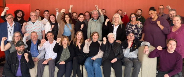 Delegates to CWA Canada's annual National Representative Council salute Martin O'Hanlon as the inaugural winner of the union's Award of Excellence. 
